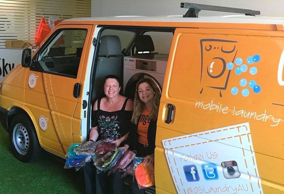 Employees volunteering for the Orange Sky Mobile Laundry