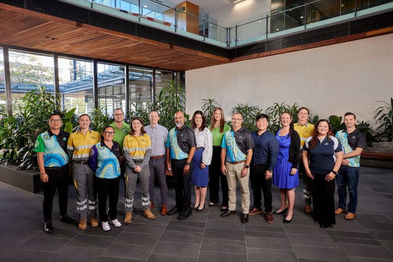 A group of Energy Queensland employees in the building foyer